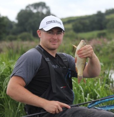 Adam Rumble holding a fish