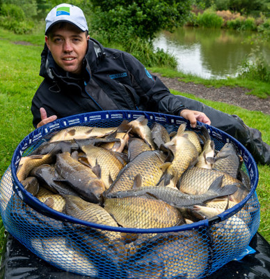 Zac Brown next to fish