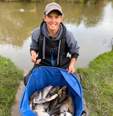 Angler Kayleigh Smith next to fish