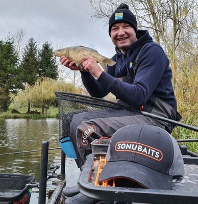 Angler Jake Fowles holding a fish