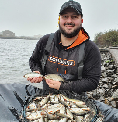 John Harvey next to fish